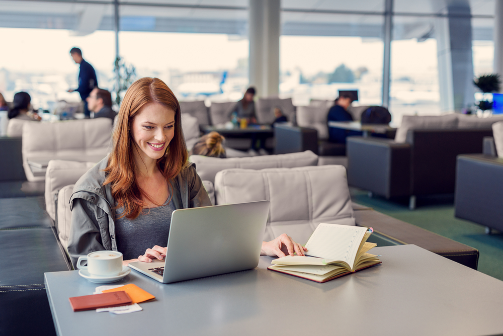 Woman Working in Airport Lounge